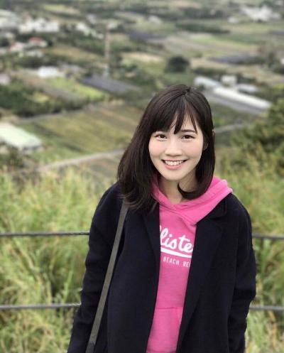 Amber wearing a pink hoodie